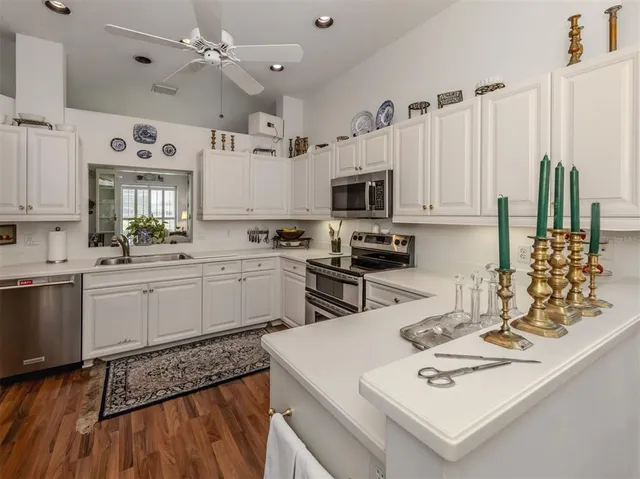 a kitchen with a sink stove and microwave