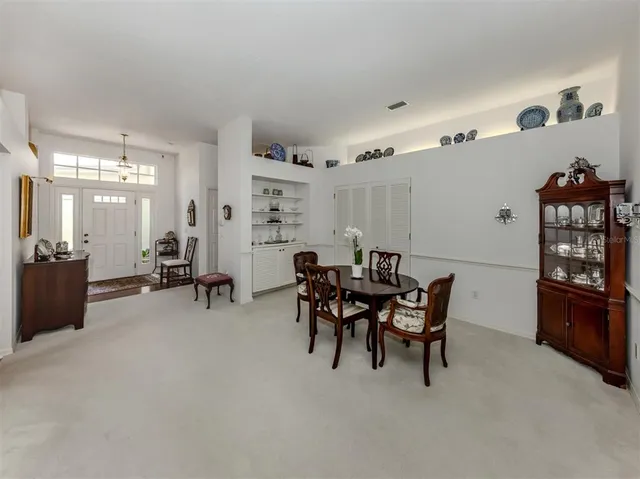 a view of a dining room with furniture