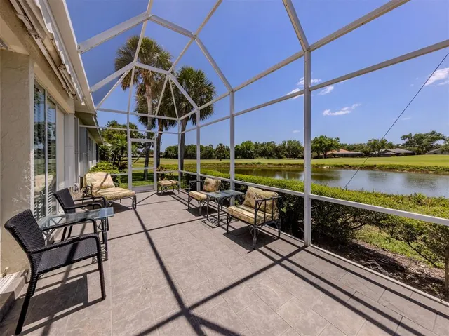 a view of a chairs and table on the balcony