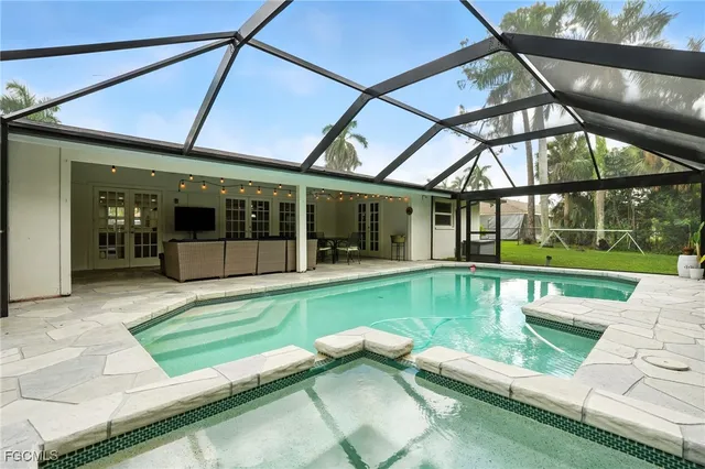 a view of swimming pool with a patio