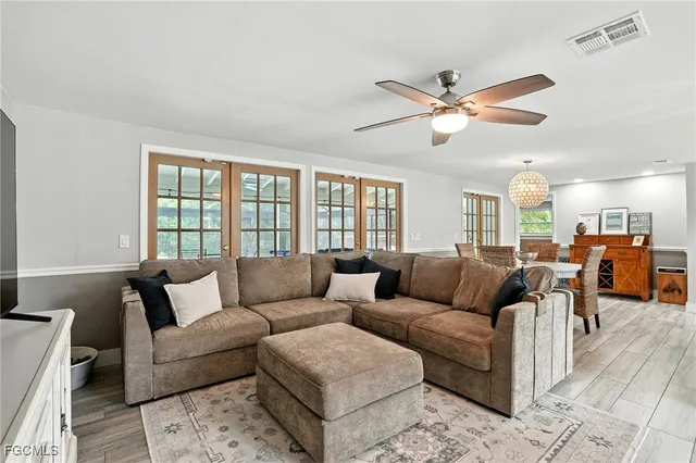 a living room with furniture and a window