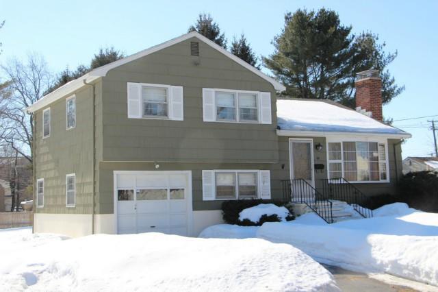 a front view of a house with a yard outdoor seating and barbeque oven