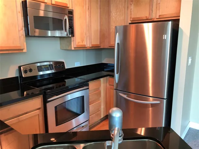 a kitchen with a sink and a window