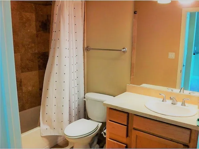 a view of a swimming pool with chairs