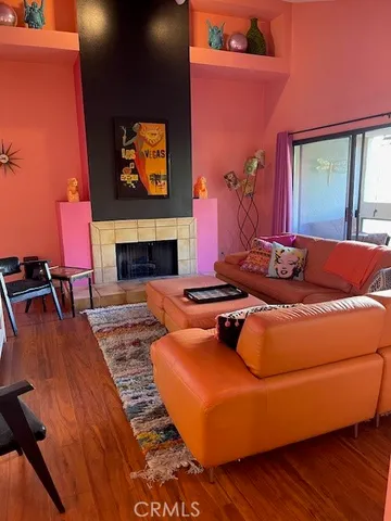 a living room with furniture rug and a fireplace