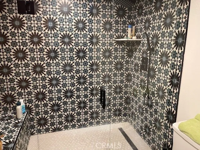 a bedroom with a bed and walk in closet