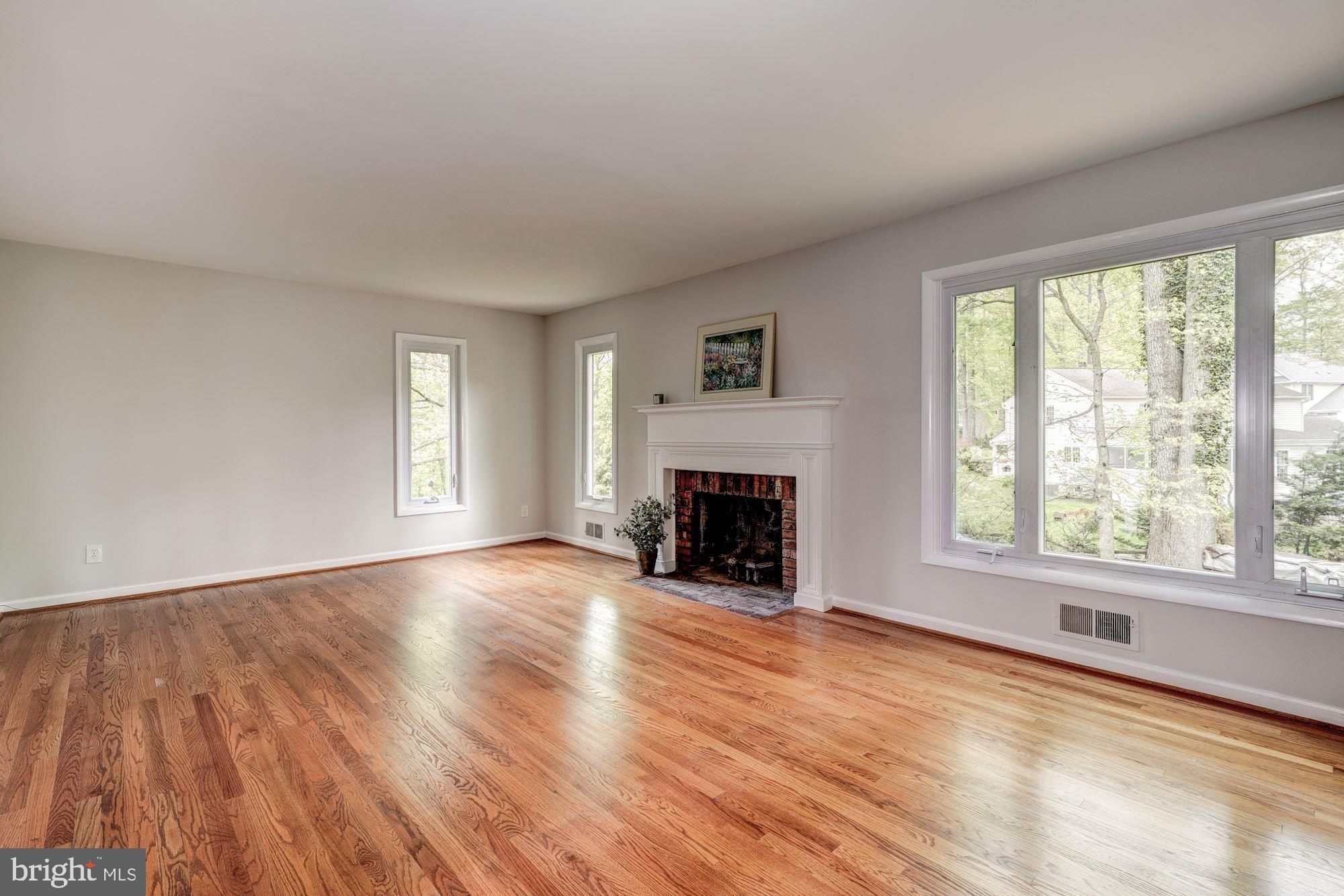 2013 Dundee Road Rockville, MD 20850 - Photo 2 of 31 Large living room with fireplace