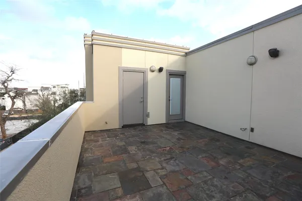 a view of a back yard from a balcony