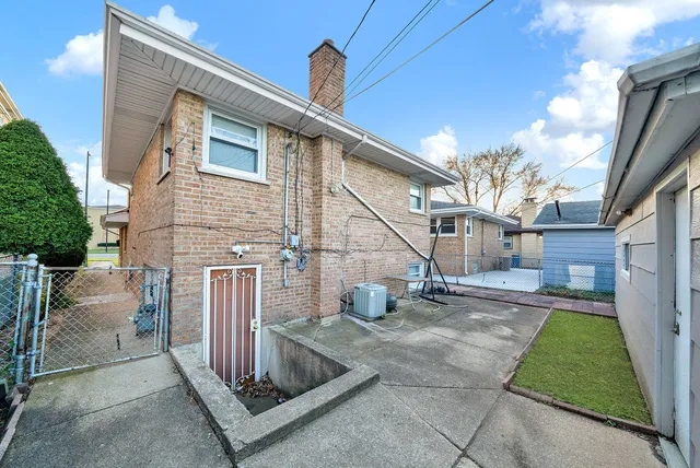 a view of a house with a sink and a yard