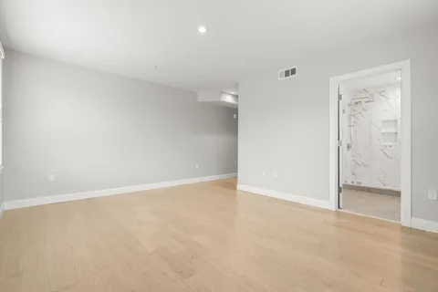 an empty room with a bathroom