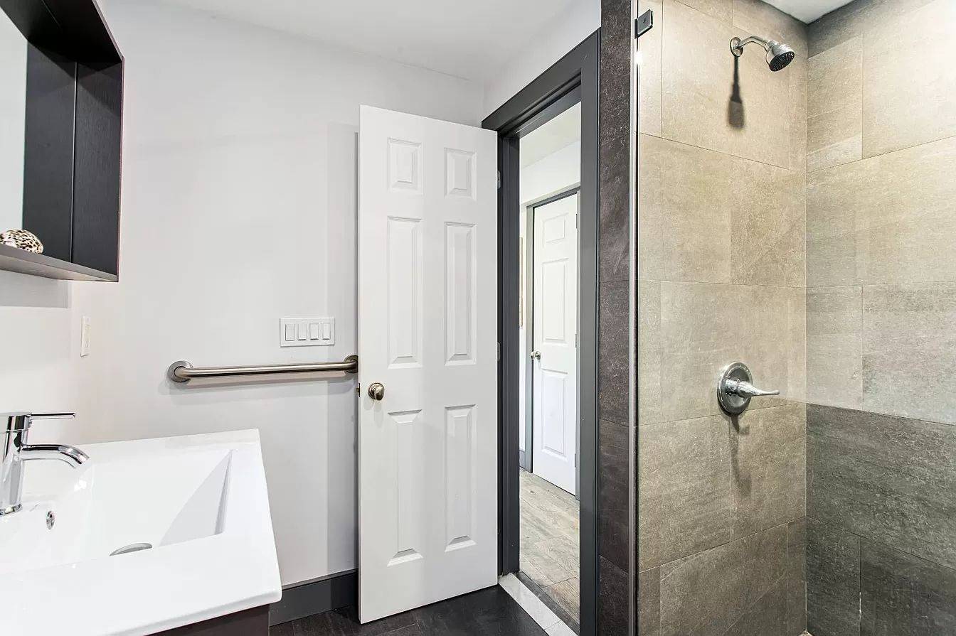 3752 Noyack Road Sag Harbor, NY 11963 - Photo 11 of 17 a bathroom with a tub and shower
