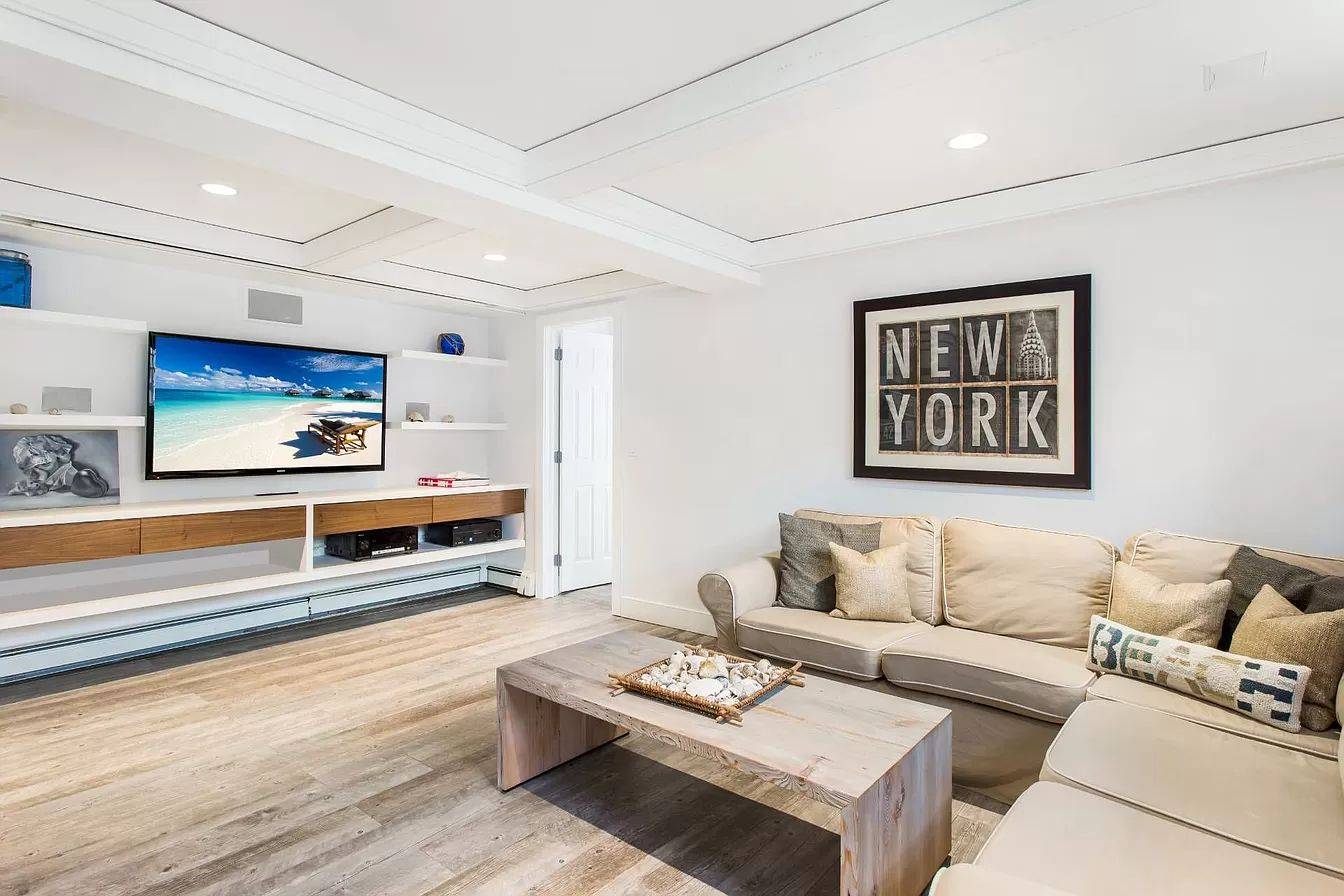 3752 Noyack Road Sag Harbor, NY 11963 - Photo 12 of 17 a living room with furniture and a flat screen tv