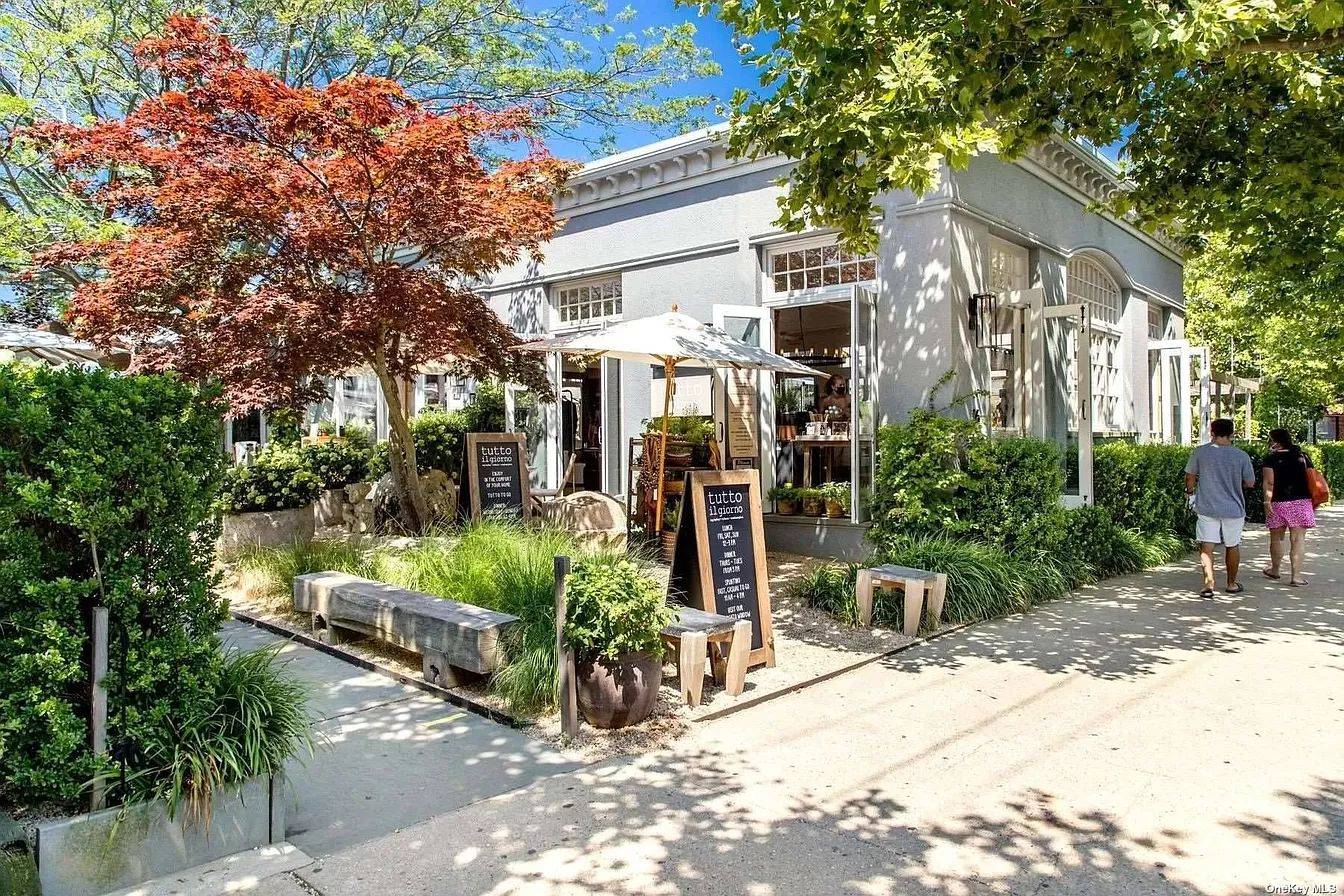 3752 Noyack Road Sag Harbor, NY 11963 - Photo 15 of 17 a view of a house with sitting area and garden
