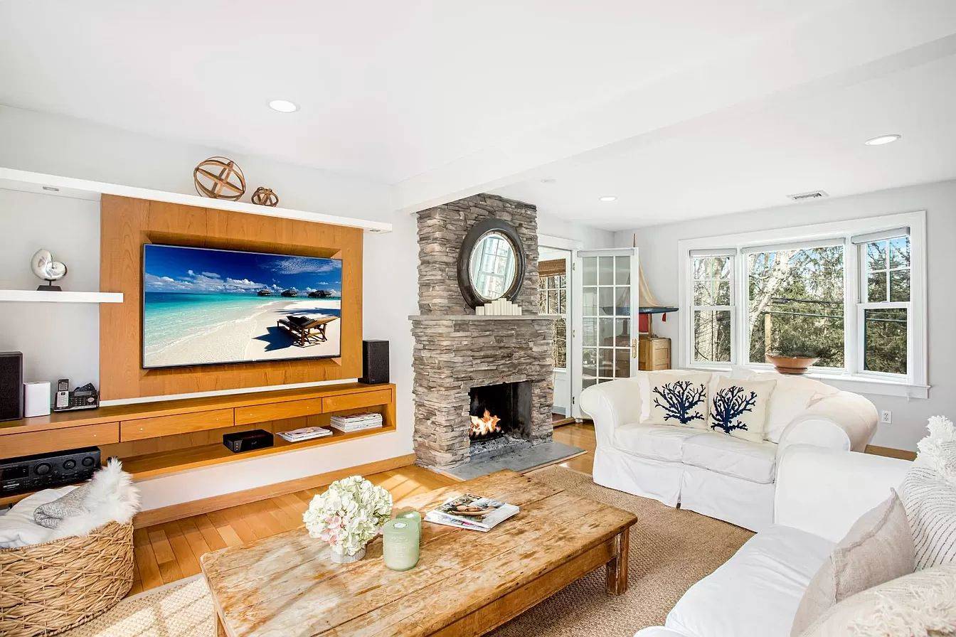 3752 Noyack Road Sag Harbor, NY 11963 - Photo 4 of 17 a living room with furniture and a fireplace