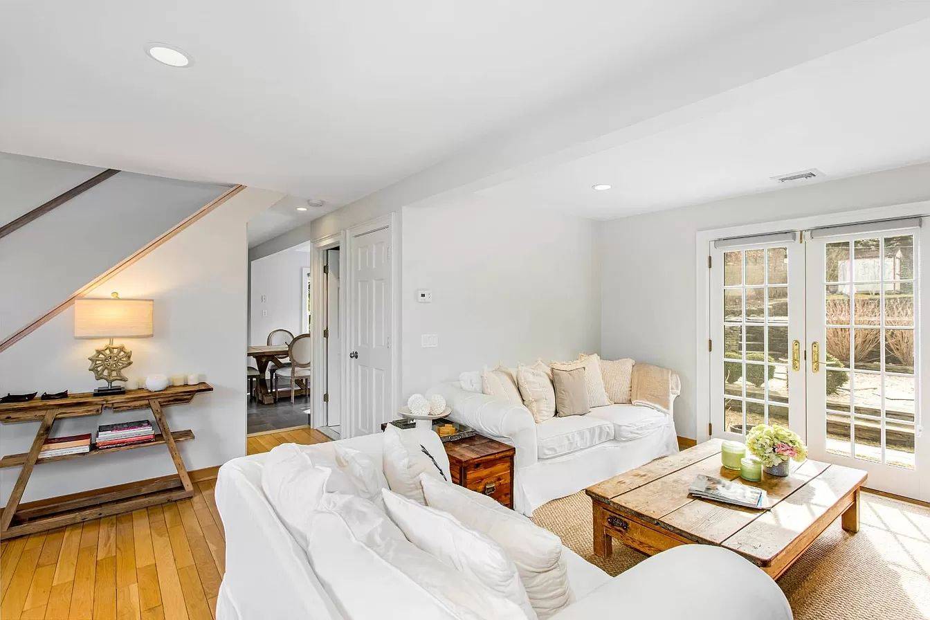 3752 Noyack Road Sag Harbor, NY 11963 - Photo 5 of 17 a living room with furniture and a large window