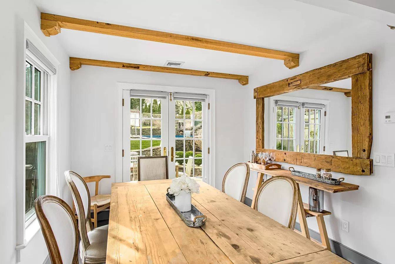 3752 Noyack Road Sag Harbor, NY 11963 - Photo 7 of 17 a view of a dining room with furniture and windows