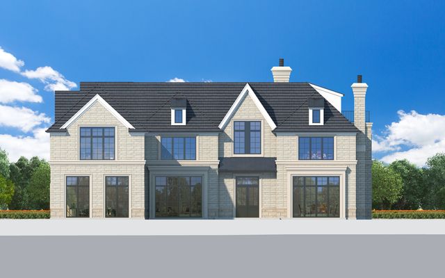 a view of a brick house with large windows