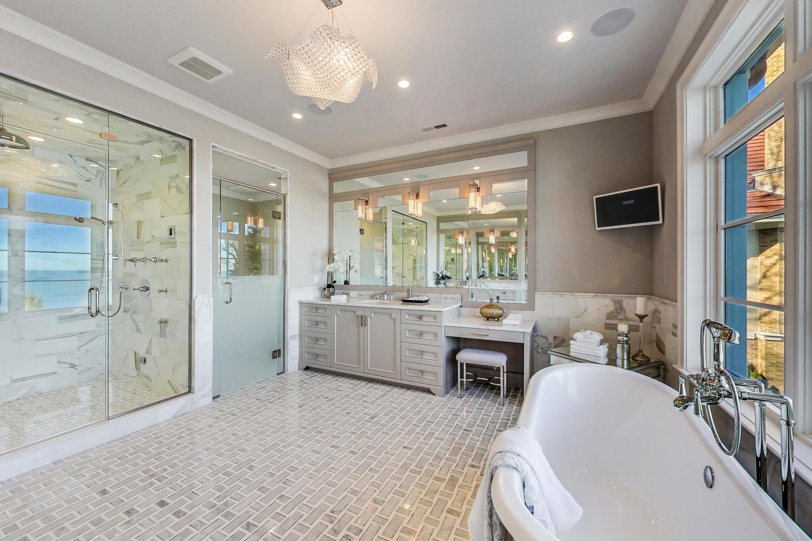501 Sheridan Road Kenilworth, IL 60043 - Photo 11 of 20 a bathroom with a sink a mirror and a bathtub