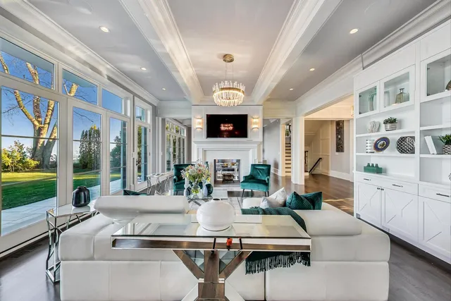 a living room with furniture fireplace and flat screen tv