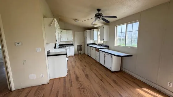 a kitchen with a sink and cabinets