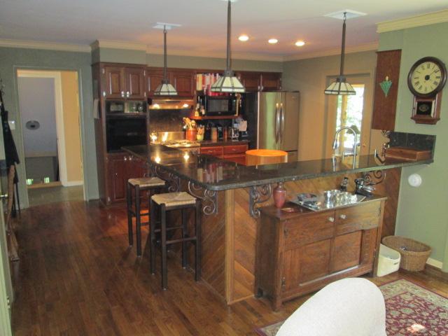 117 Hickory Hills Road Tullahoma, TN 37388 - Photo 3 of 20 Eat at bar seats six. The kitchen includes cherry cabinets, granite counters/backsplash, gas stove, and second built-in oven.