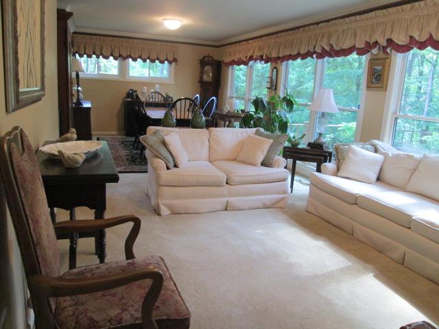 117 Hickory Hills Road Tullahoma, TN 37388 - Photo 6 of 20 Formal living room has lots of windows and adjoins the formal dining room.