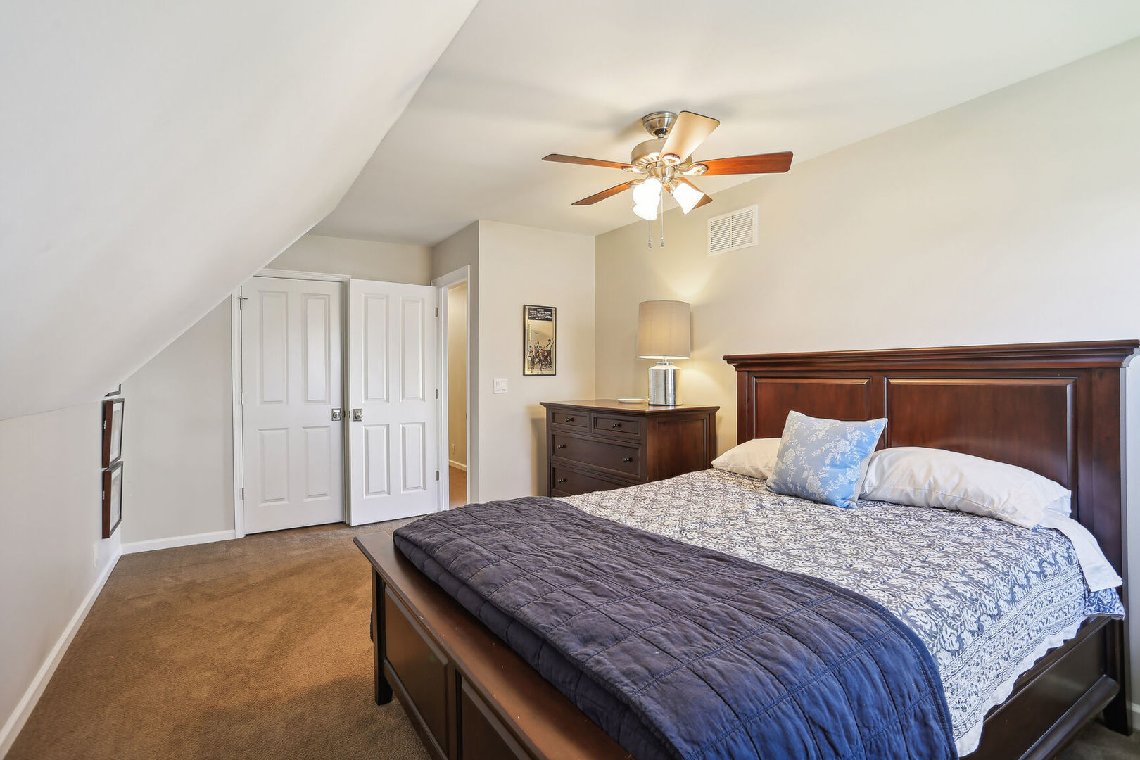 2711 North Salisbury Court Champaign, IL 61821 - Photo 31 of 42 a bedroom with a large bed and chandelier