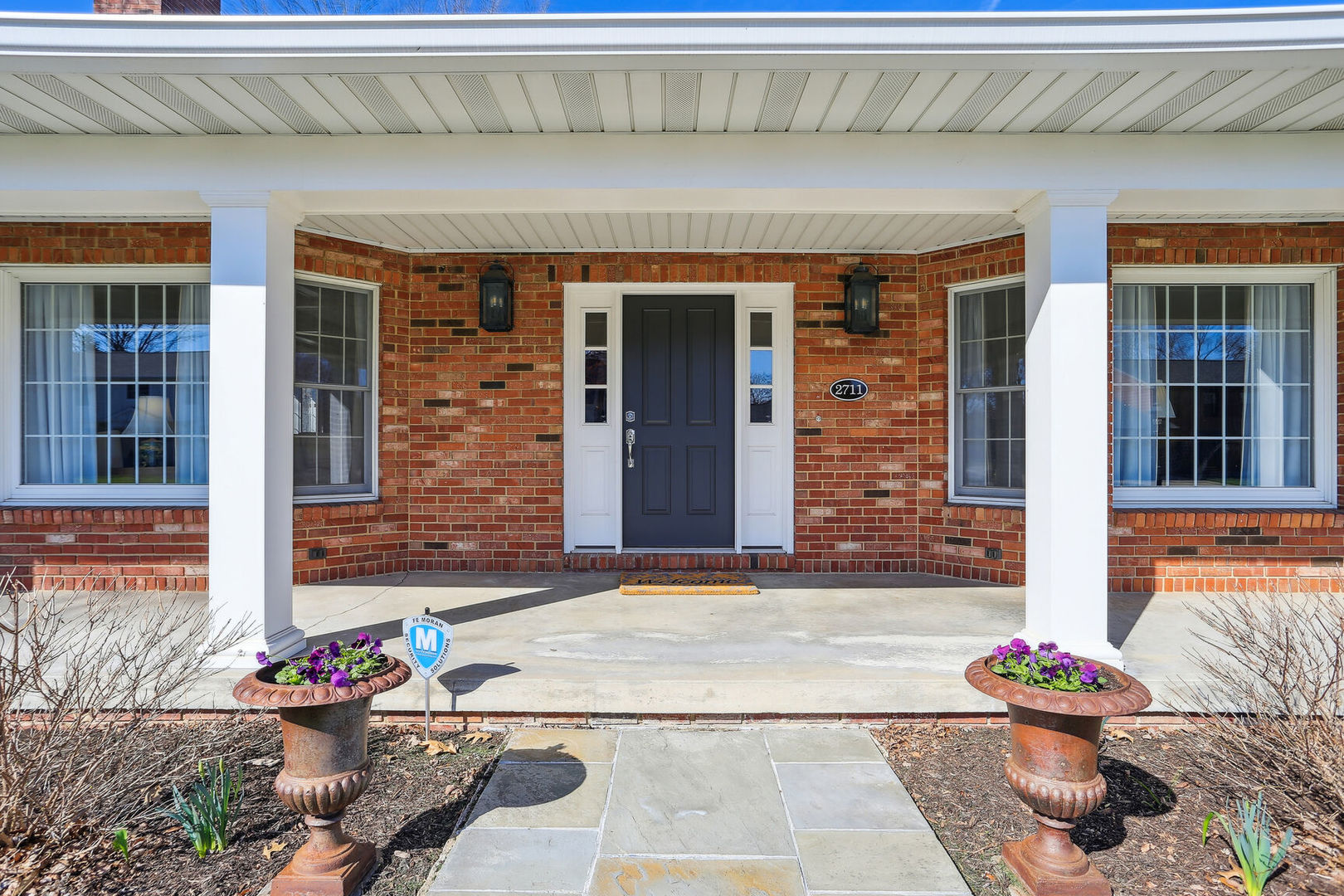 2711 North Salisbury Court Champaign, IL 61821 - Photo 4 of 42 a front view of a house with an outdoor seating