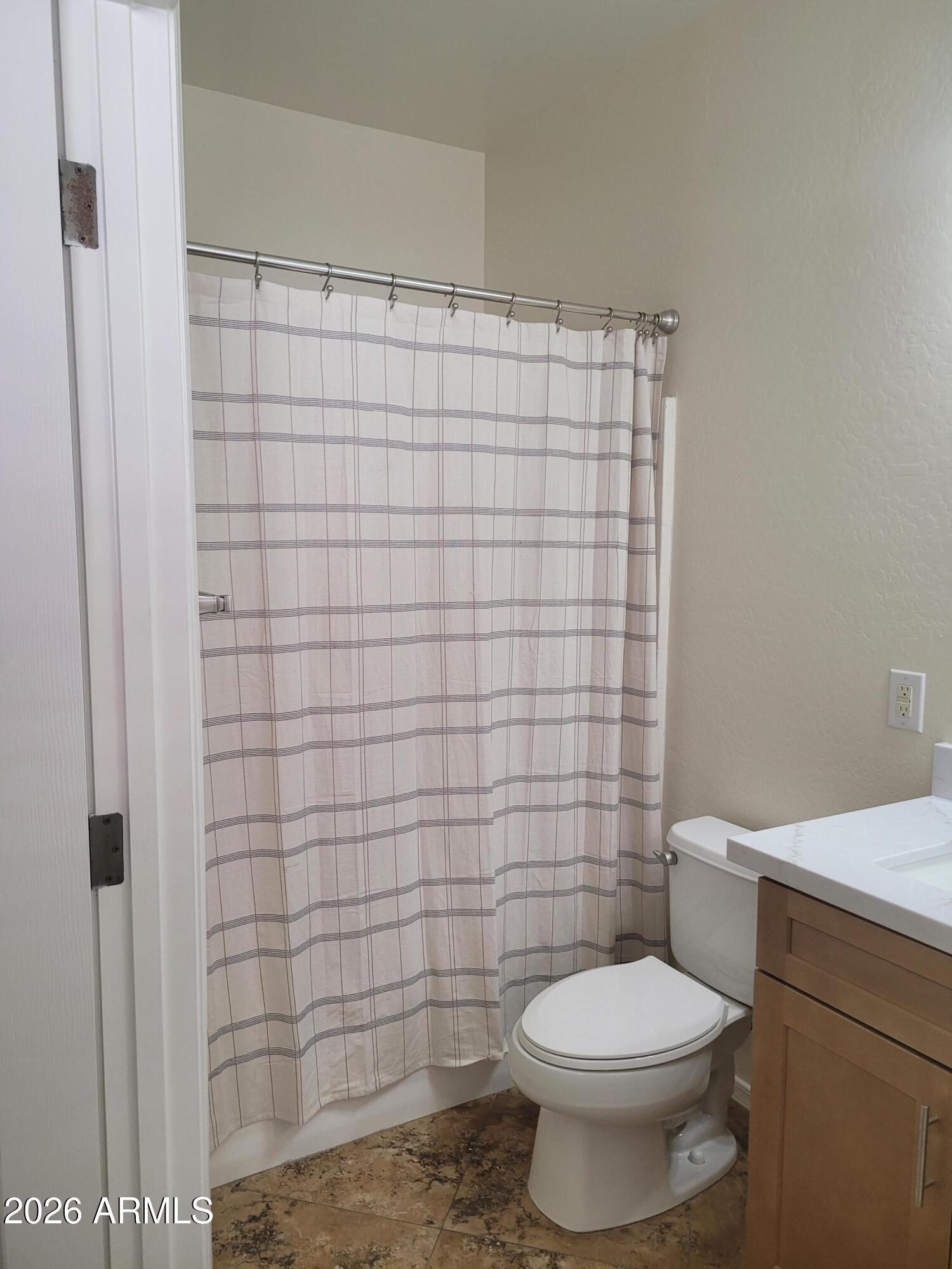 1453 South Sinova Avenue Gilbert, AZ 85296 - Photo 25 of 46 a bathroom with a toilet and a shower