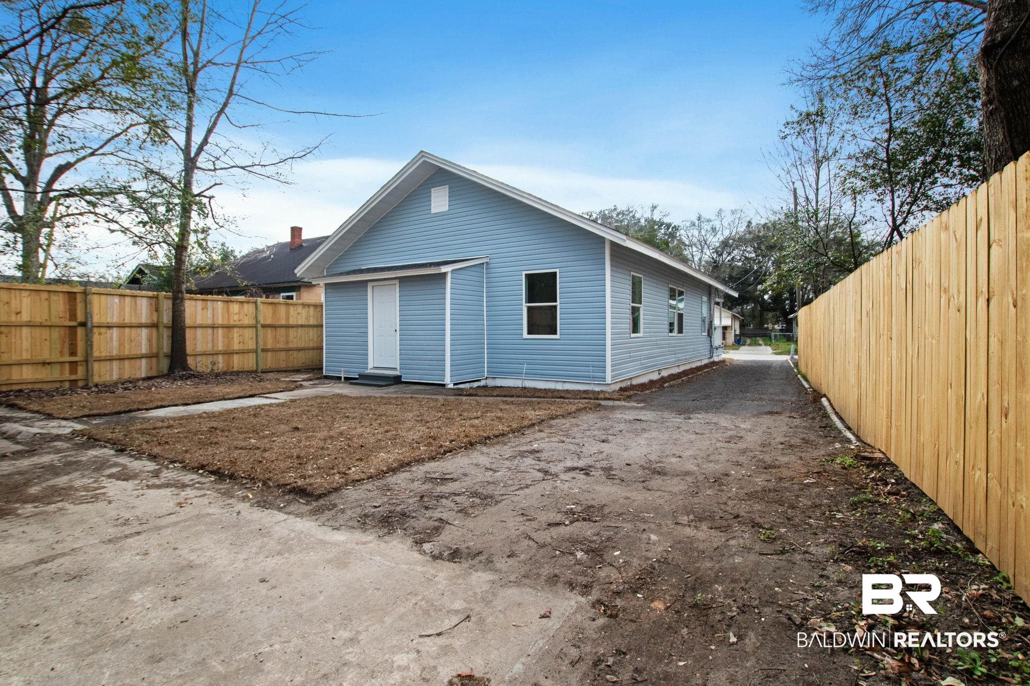 128 Bush Avenue Mobile, AL 36604 - Photo 37 of 40 Rear view of property with a fenced backyard and dirt driveway