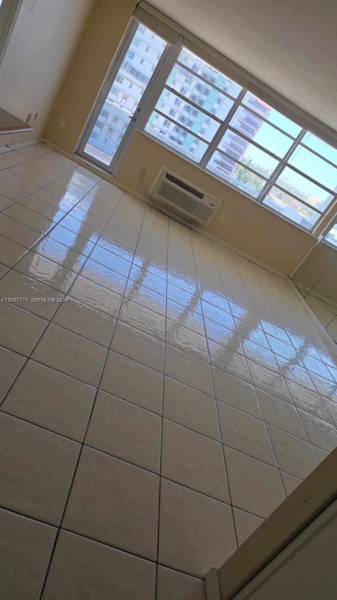 5313 Collins Avenue, Unit 906 Miami Beach, FL 33140 - Photo 1 of 3 a view of a floor to ceiling window