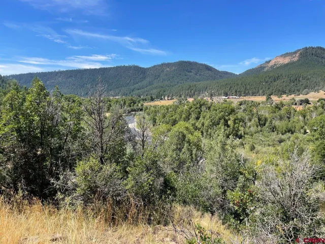 a view of a town with mountains in the background