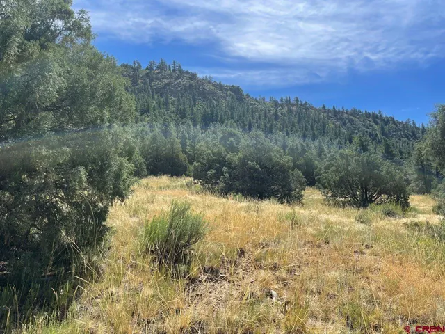 a view of a lake view with mountains in the background