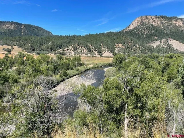 a view of a lake with a mountain in the background