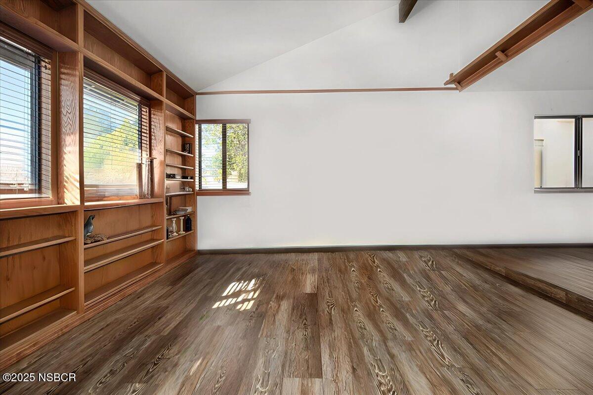 628 St Andrews Way Lompoc, CA 93436 - Photo 13 of 36 a view of an empty room with wooden floor and a window