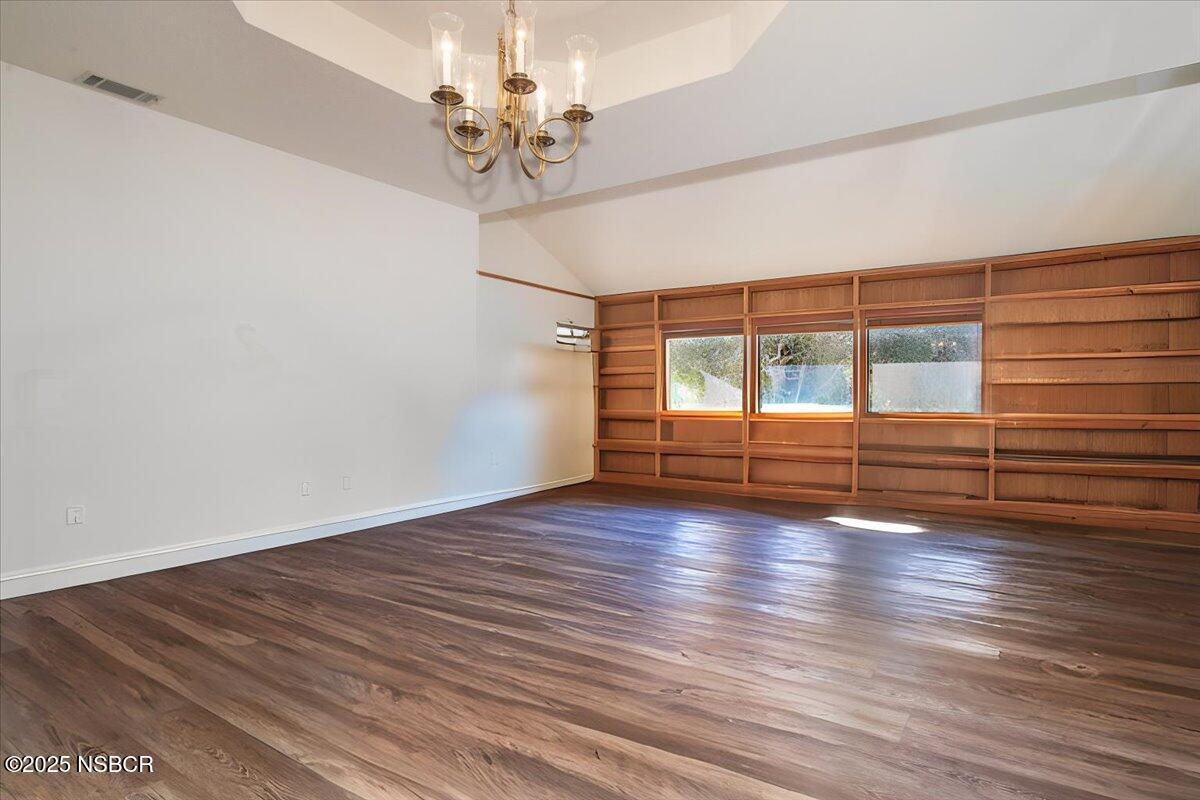628 St Andrews Way Lompoc, CA 93436 - Photo 15 of 36 a view of empty room with wooden floor and fan