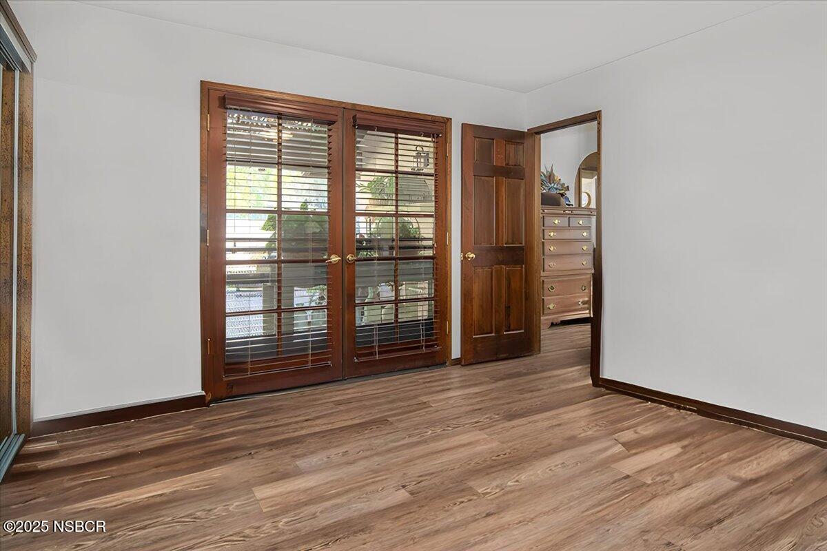 628 St Andrews Way Lompoc, CA 93436 - Photo 19 of 36 a view of wooden floor and windows in a room