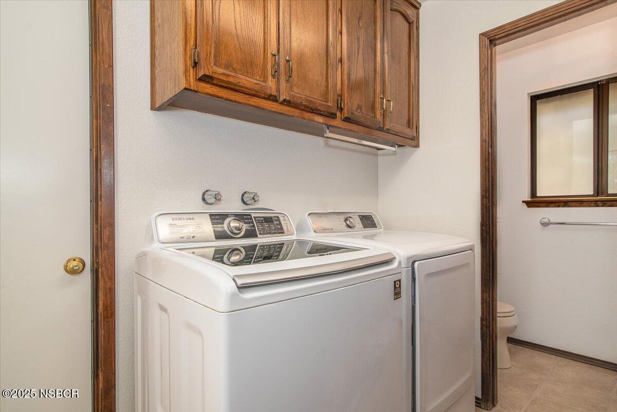 628 St Andrews Way Lompoc, CA 93436 - Photo 26 of 36 a utility room with dryer and washer