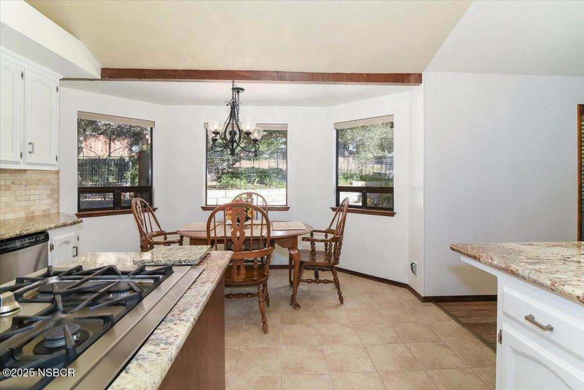 628 St Andrews Way Lompoc, CA 93436 - Photo 8 of 36 a living room with furniture and a table
