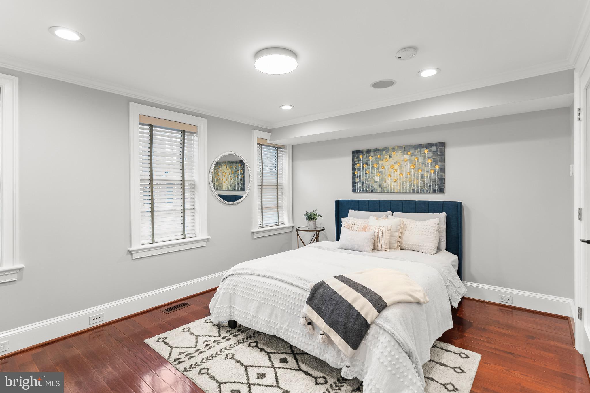 123 South Fayette Street Alexandria, VA 22314 - Photo 12 of 41 a bedroom with a large bed and a window