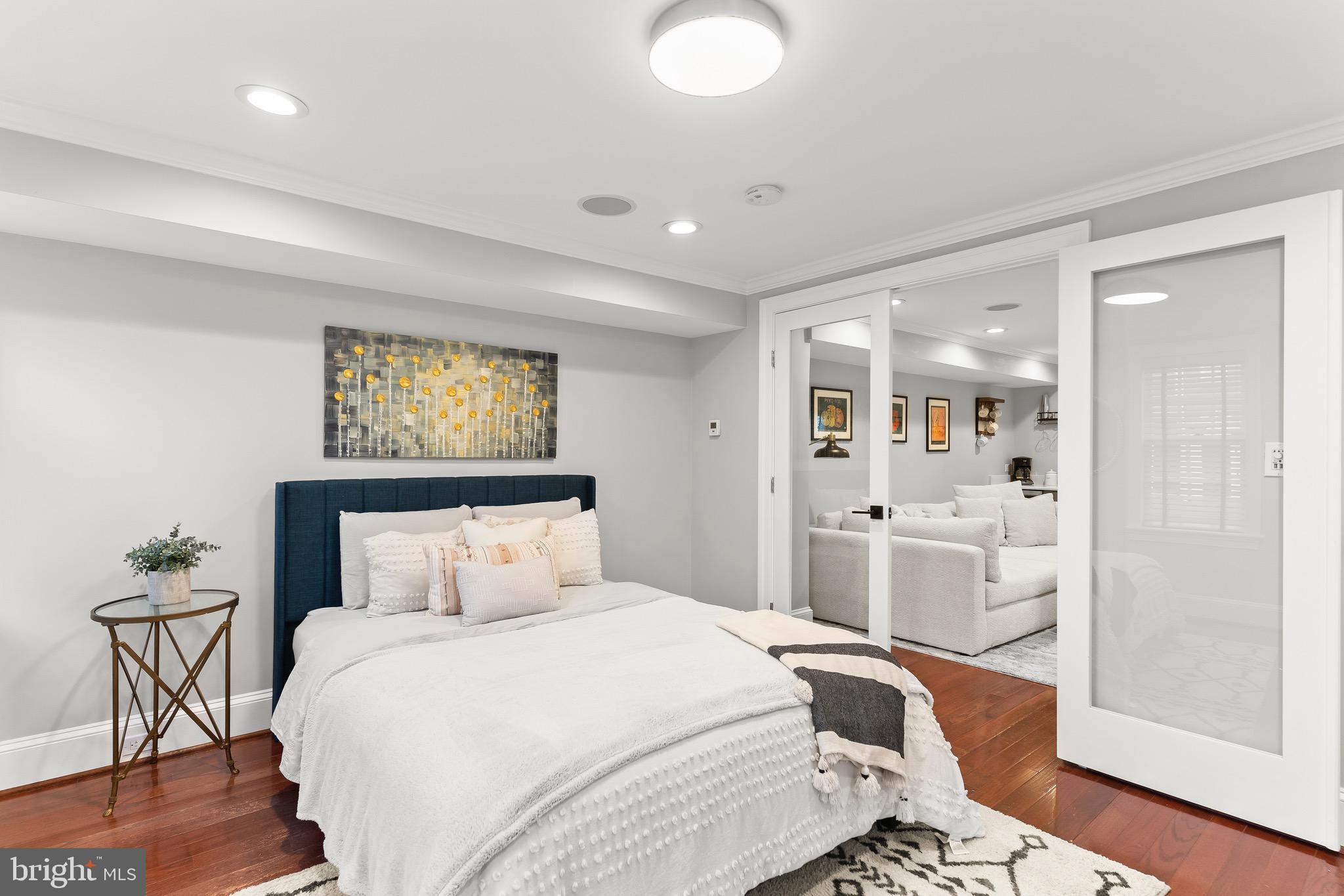 123 South Fayette Street Alexandria, VA 22314 - Photo 13 of 41 a bedroom with a bed and wooden floor