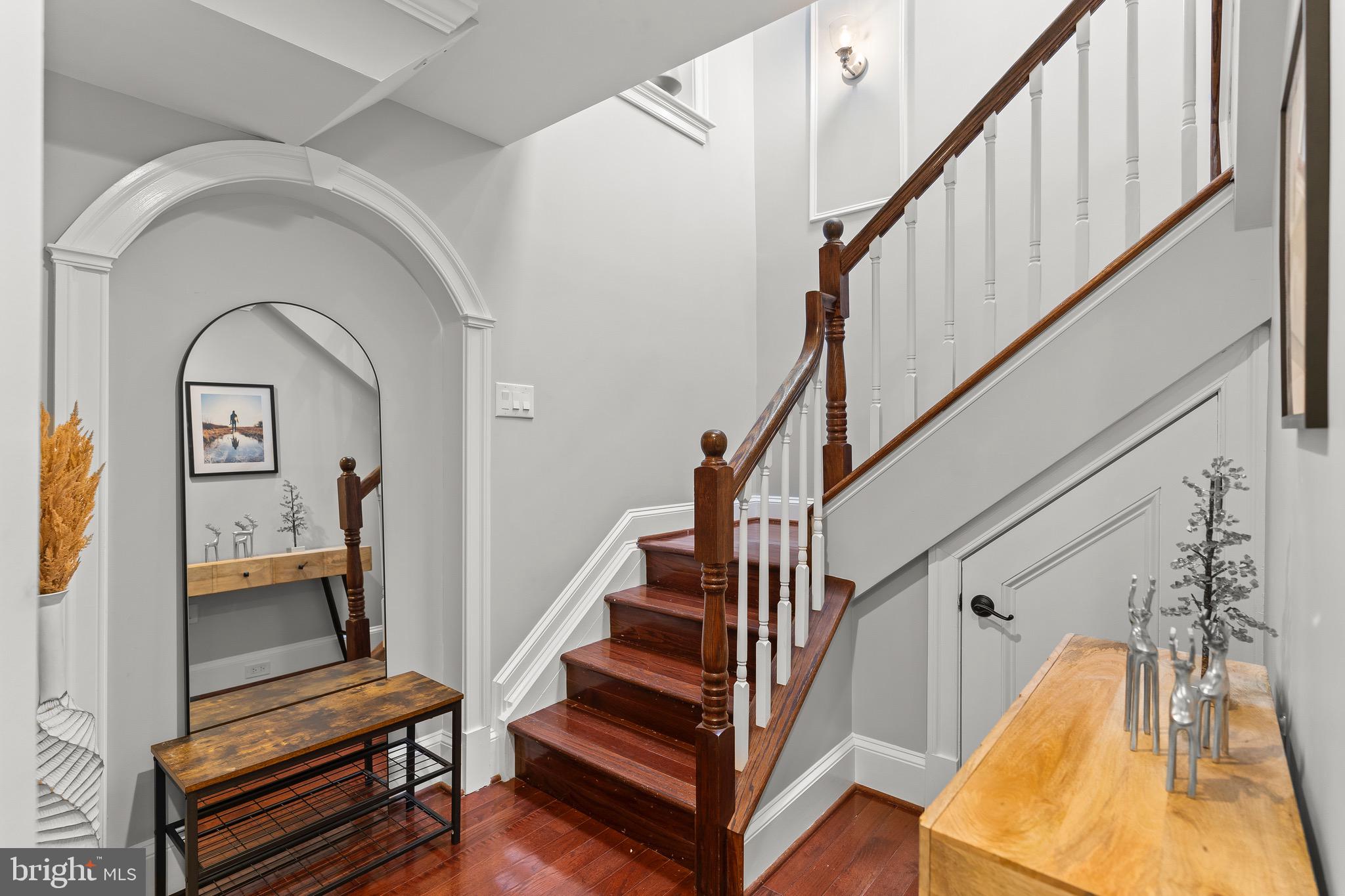 123 South Fayette Street Alexandria, VA 22314 - Photo 18 of 41 a view of staircase with wooden floor and a rug