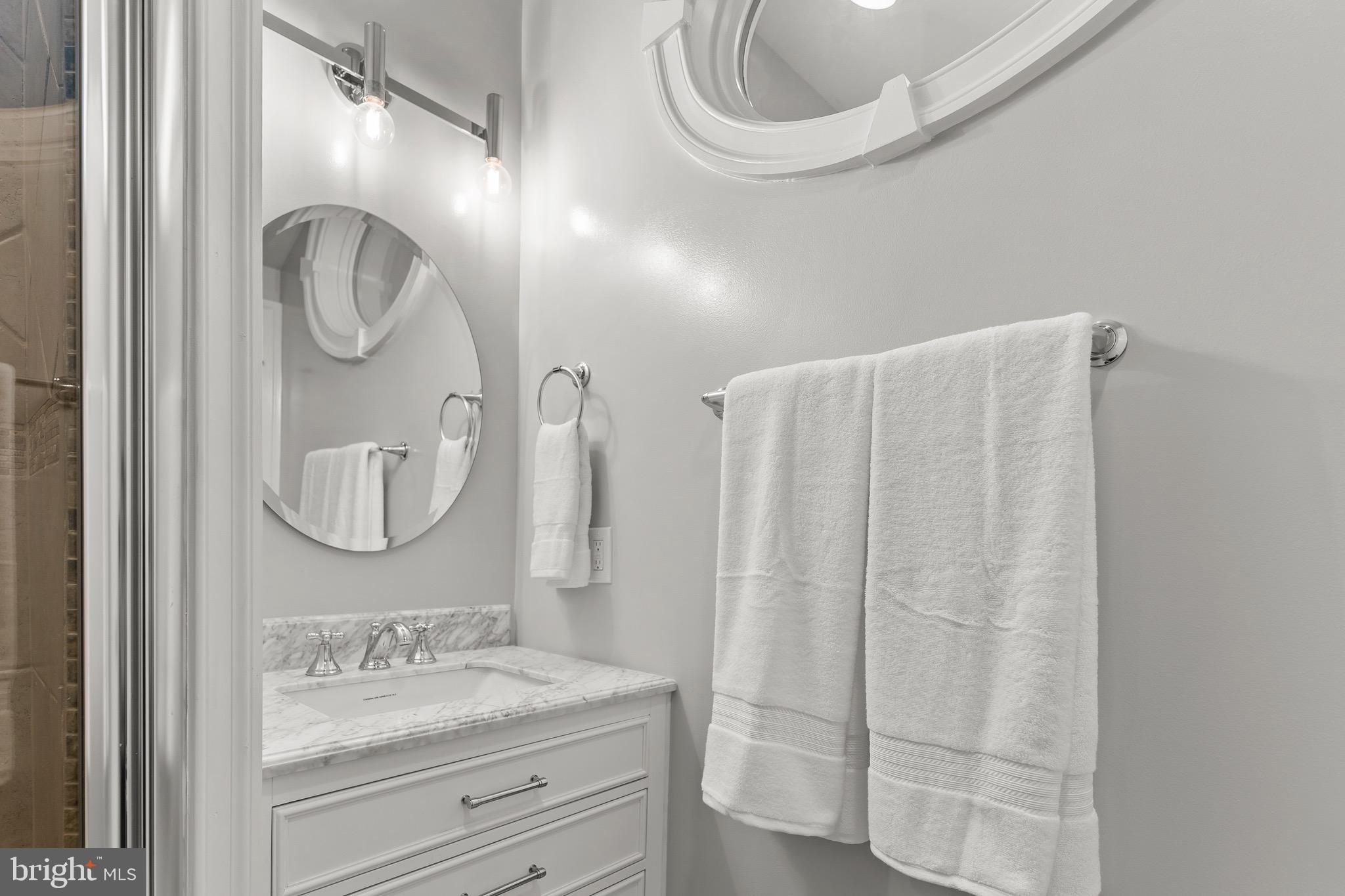 123 South Fayette Street Alexandria, VA 22314 - Photo 19 of 41 a bathroom with a sink a vanity and a mirror