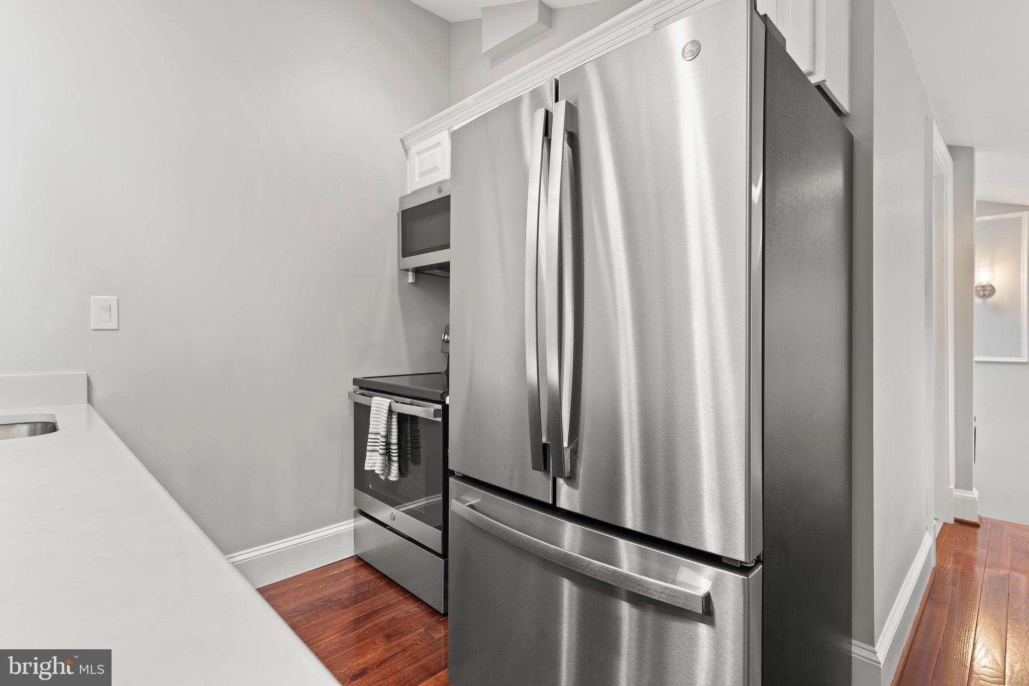 123 South Fayette Street Alexandria, VA 22314 - Photo 24 of 41 a metallic refrigerator freezer sitting in a kitchen