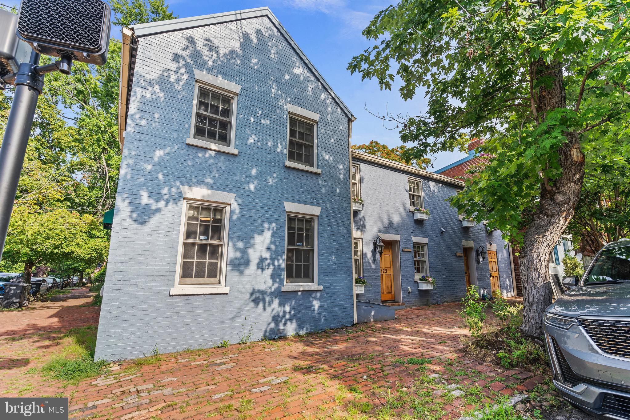 123 South Fayette Street Alexandria, VA 22314 - Photo 4 of 41 a front view of a house with a yard tree and outdoor seating