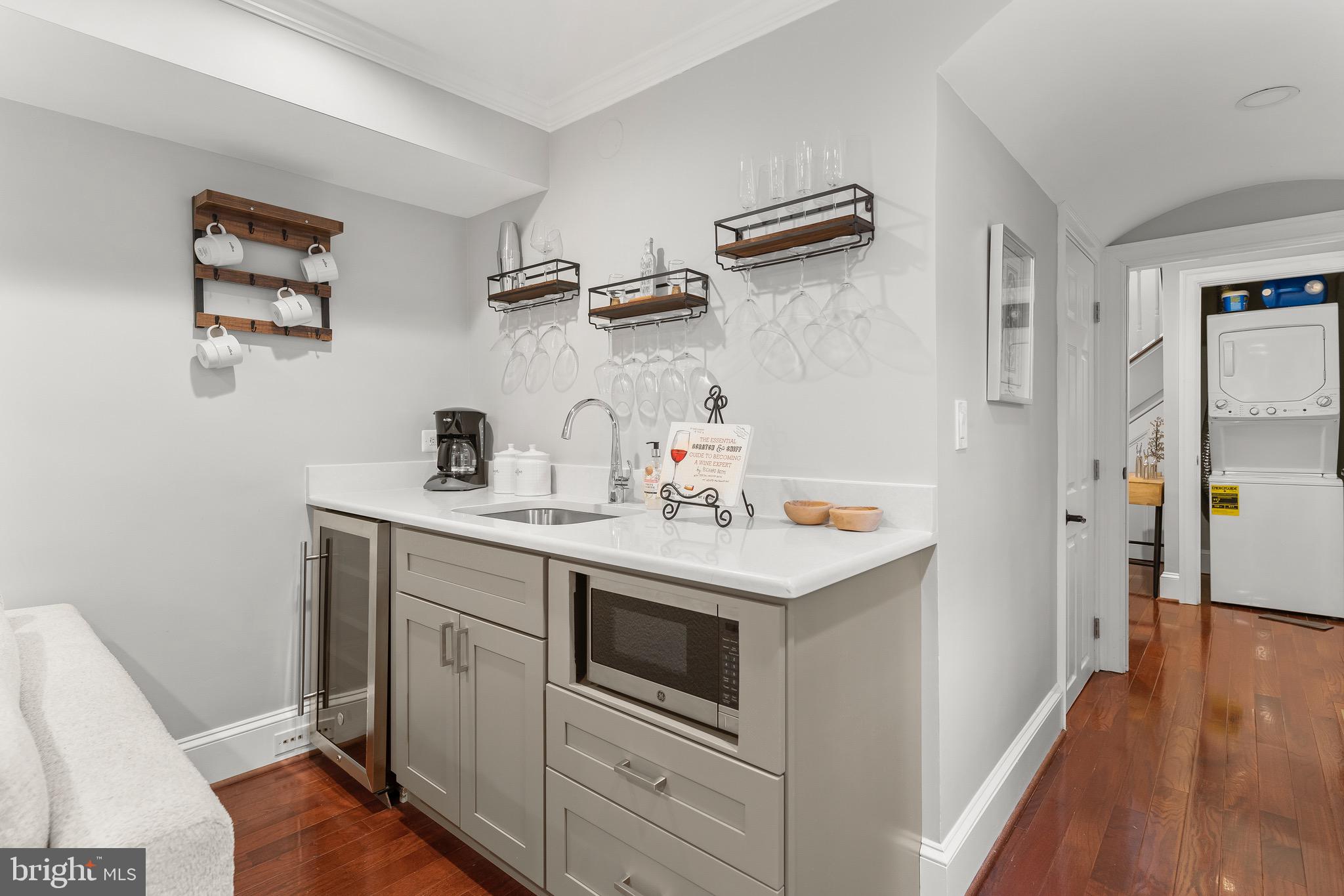 123 South Fayette Street Alexandria, VA 22314 - Photo 9 of 41 a kitchen with a sink a refrigerator and wooden floor