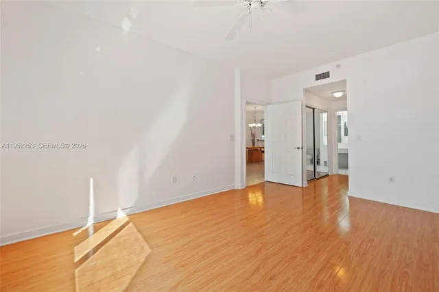 a bathroom with a double vanity sink a toilet and a mirror