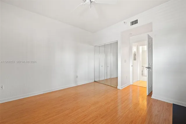 a bathroom with a shower sink vanity mirror and toilet