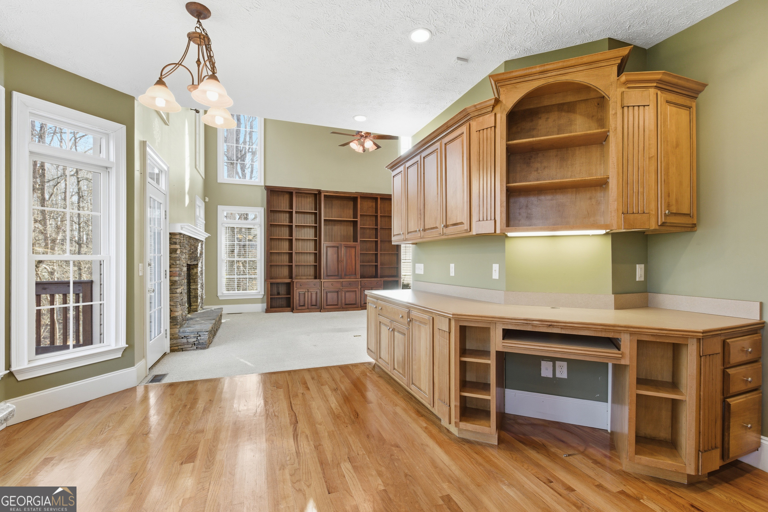 180 Springbrook Drive Cornelia, GA 30531 - Photo 11 of 50 a kitchen with a sink cabinets and wooden floor