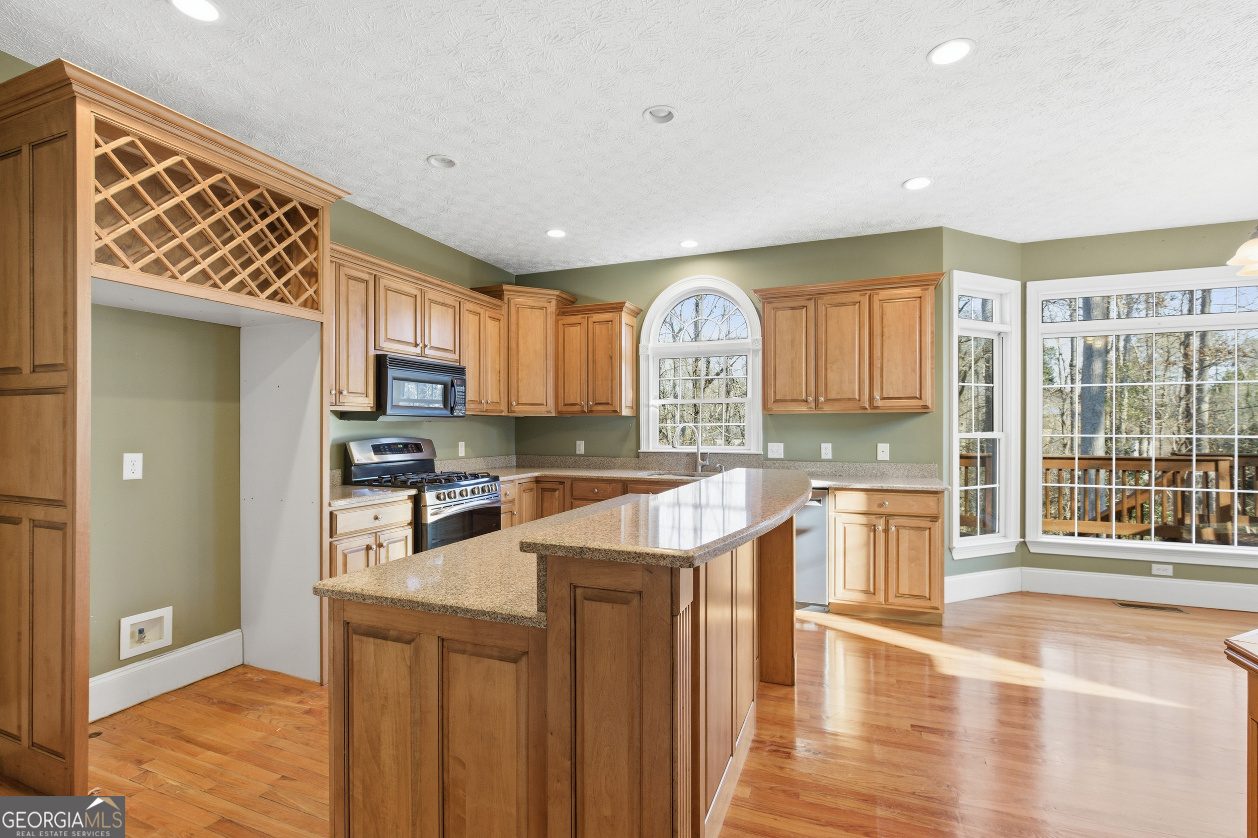180 Springbrook Drive Cornelia, GA 30531 - Photo 13 of 50 a kitchen with stainless steel appliances granite countertop a refrigerator a sink dishwasher and a stove with wooden floor